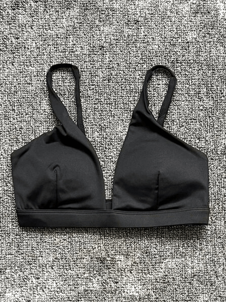 Women's quick-drying black sports bra with deep neckline for yoga